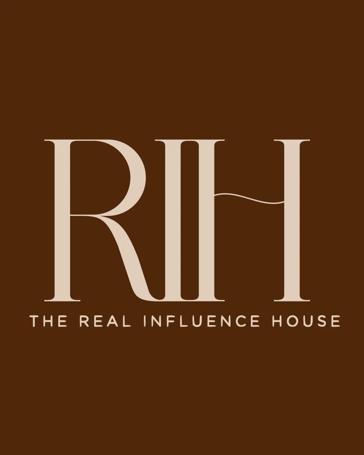 RIH's own brand card: the ligatured monogram set in paper on a field of burnt sienna